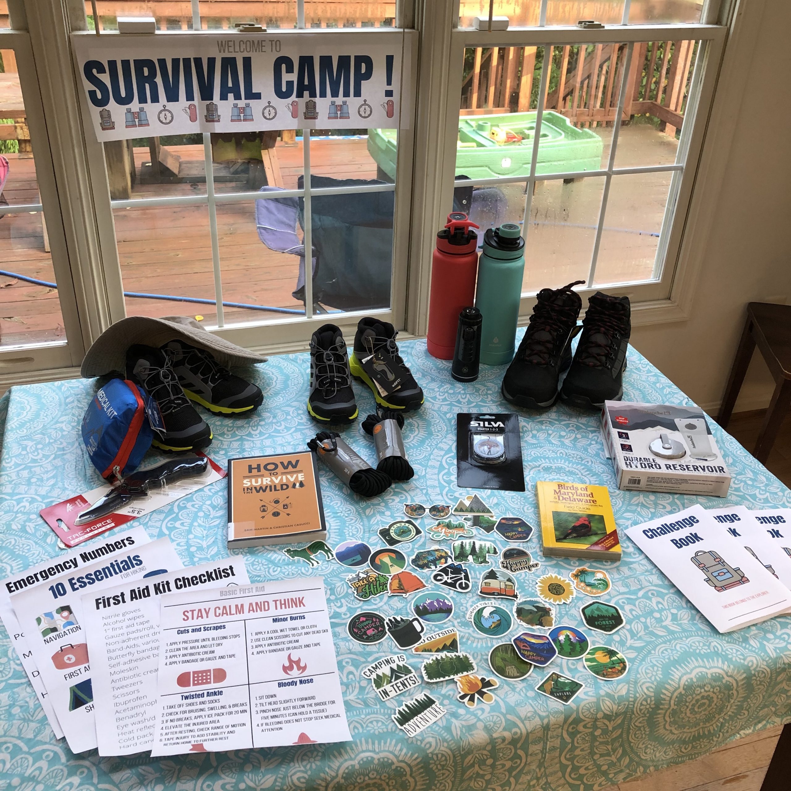 Table set with supplies for at home survival camp for kids
